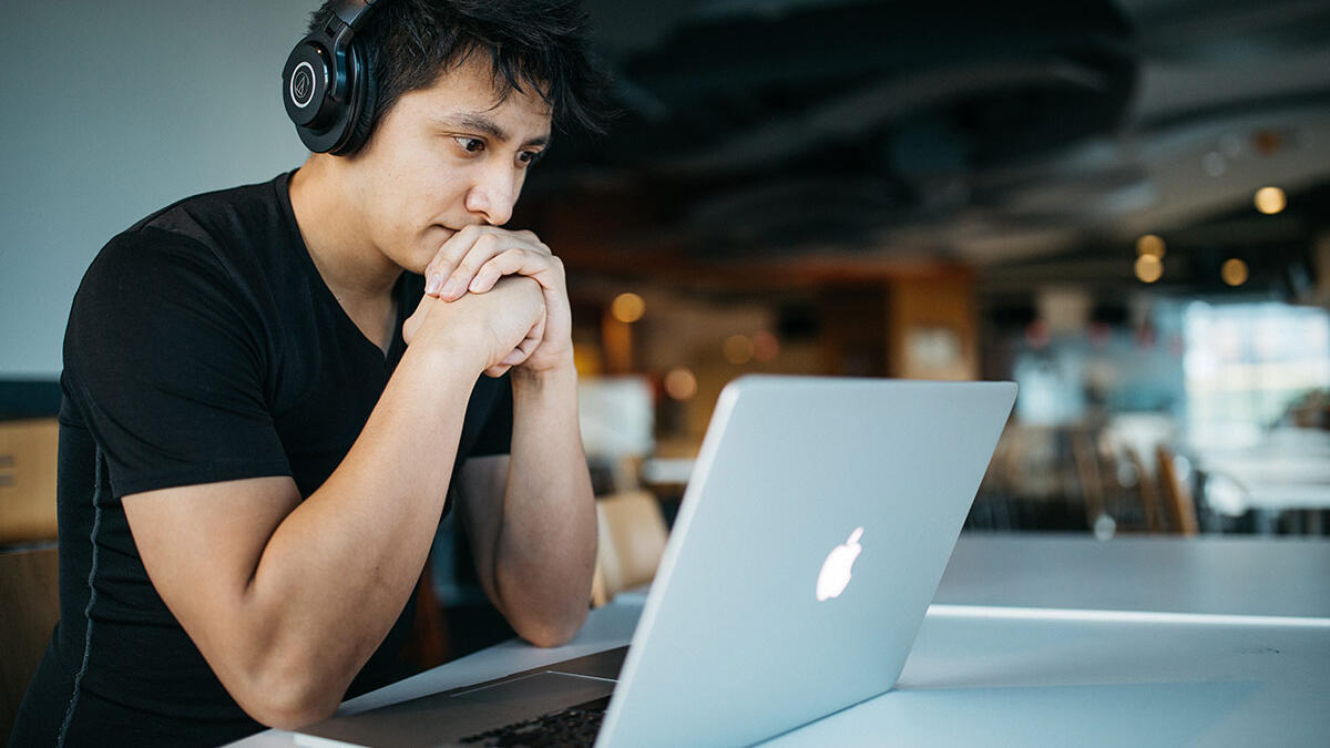 stressed man on laptop