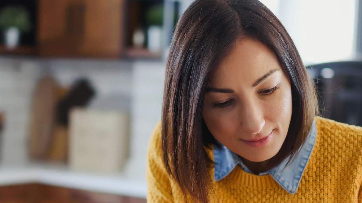 female in yellow jumper