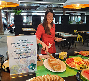 Photo of a woman in front of a buffet