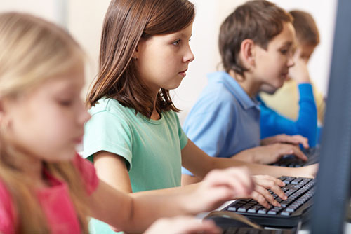 young students at computers