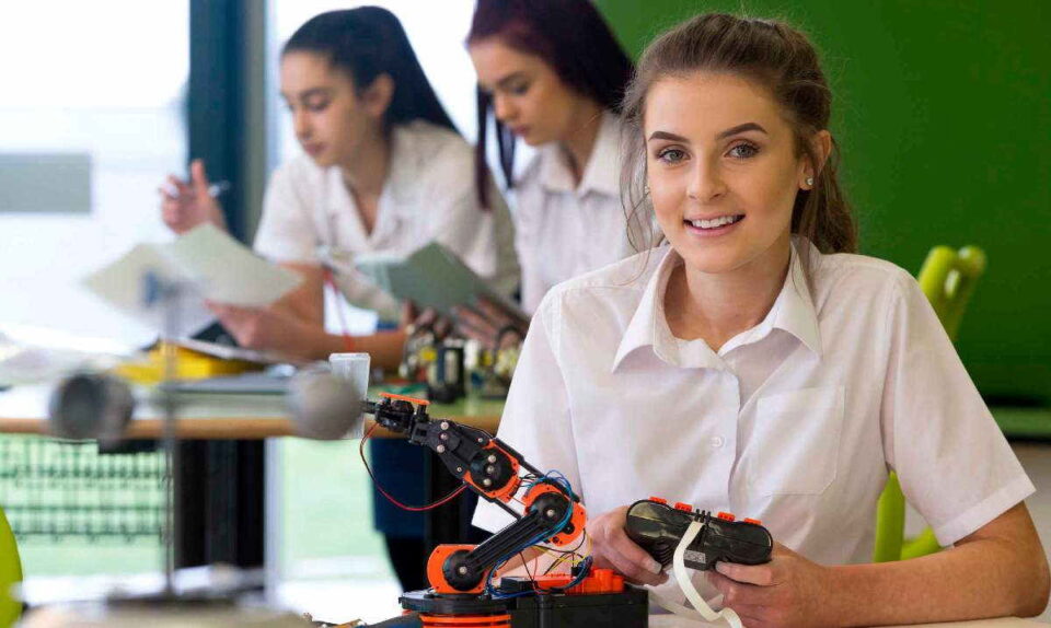 Three female students working on projects