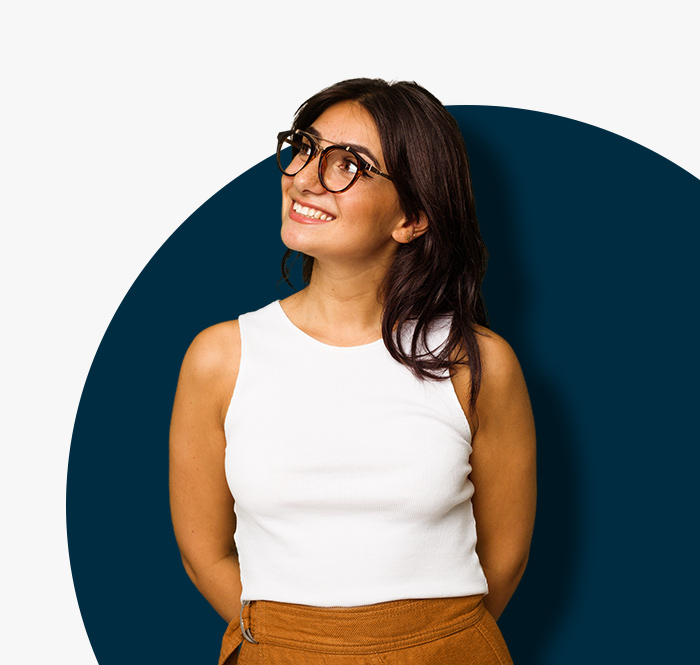 smiling girl in white top and glasses