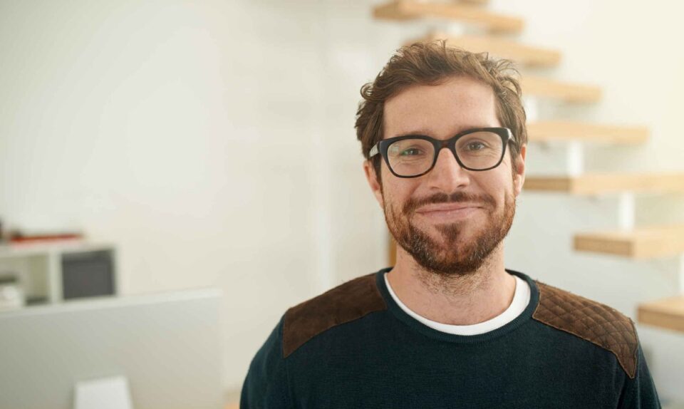 man with beard smiling