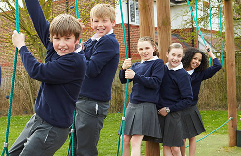 school students in uniform in playground