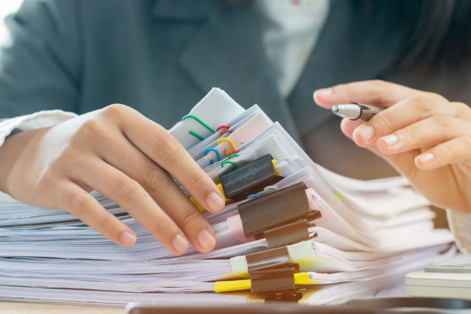 man marking papers