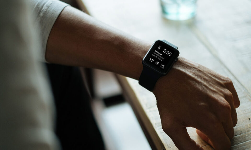 man looking at smart watch