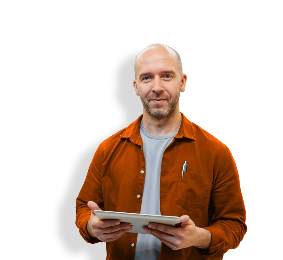 man in orange shirt authoring an online exam