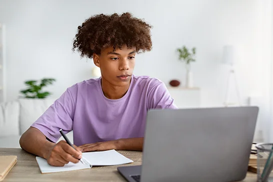 young man taking online exam
