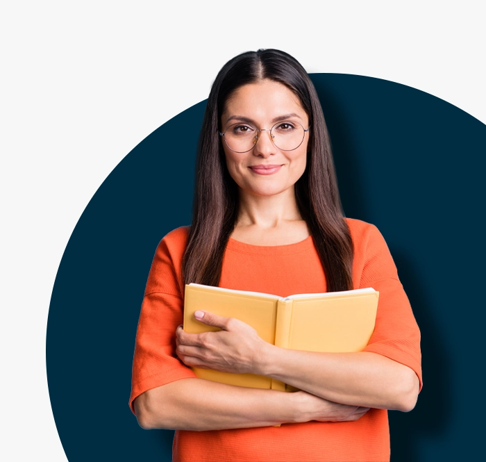 lady in orange top holding book