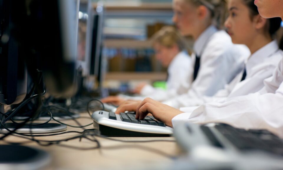 school students sitting at computers